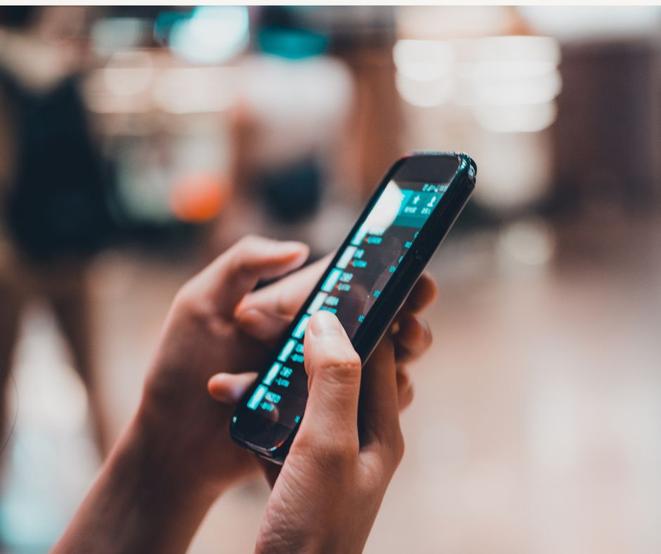 Customer looks at social media on cell phone